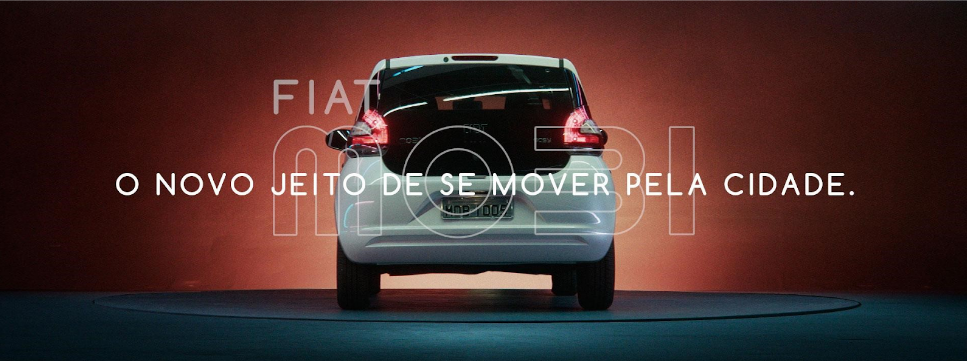 Imagem de um Fiat Mobi visto de trás com o slogan "O novo jeito de se mover pela cidade" escrita ao centro.